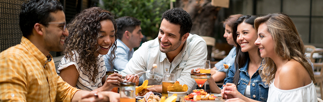 Friends Dining Together at an Outdoor Patio