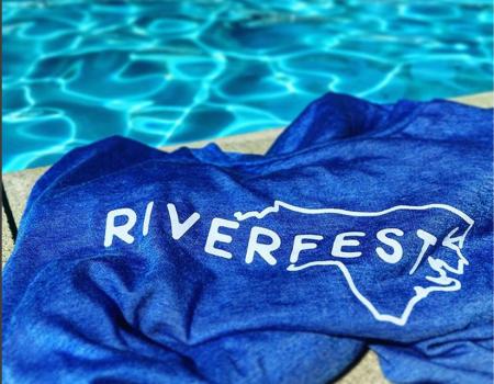 Riverfest towel next to the pool